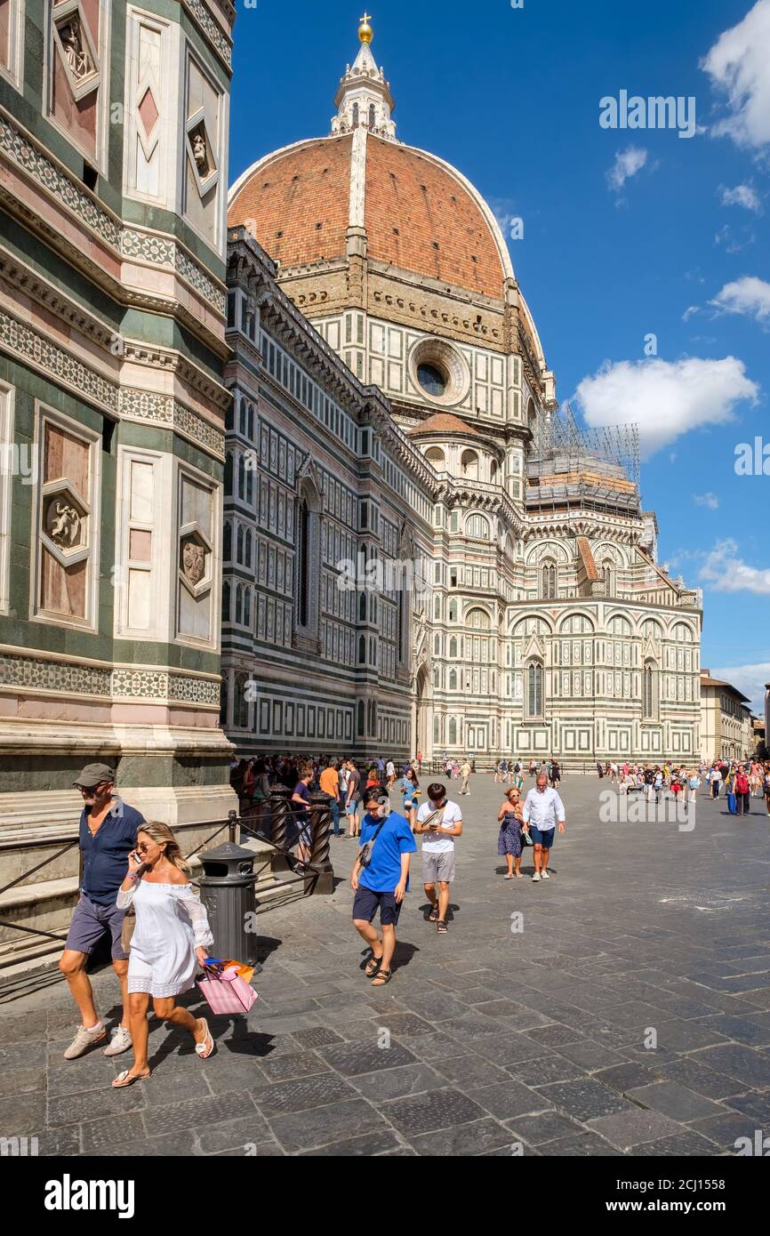 Tourists and locals at Piazza del Duomo with a view of the Cathedral of Florence Stock Photo