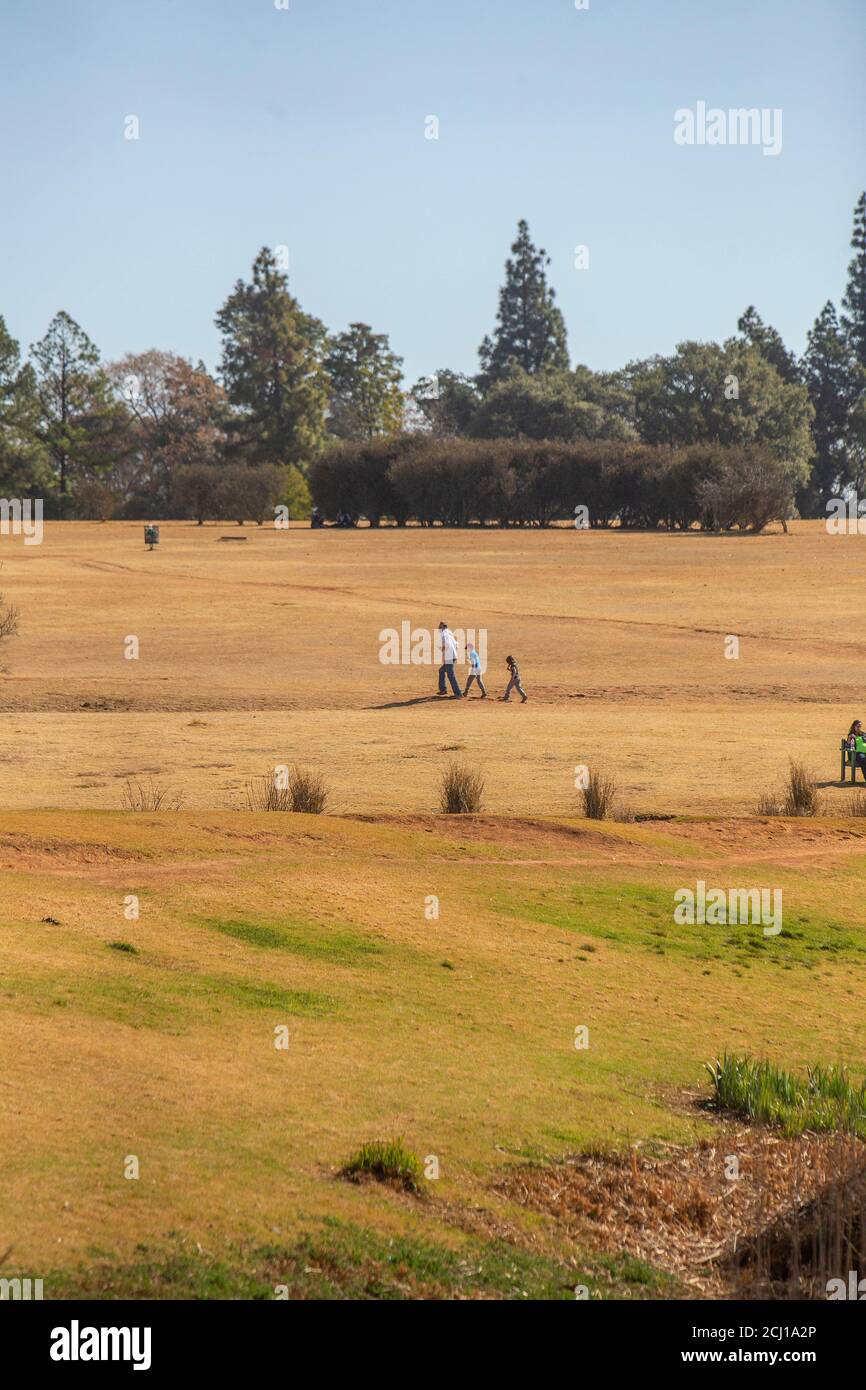African Family walking at Emmarentia Dam, Johannesburg, South Africa