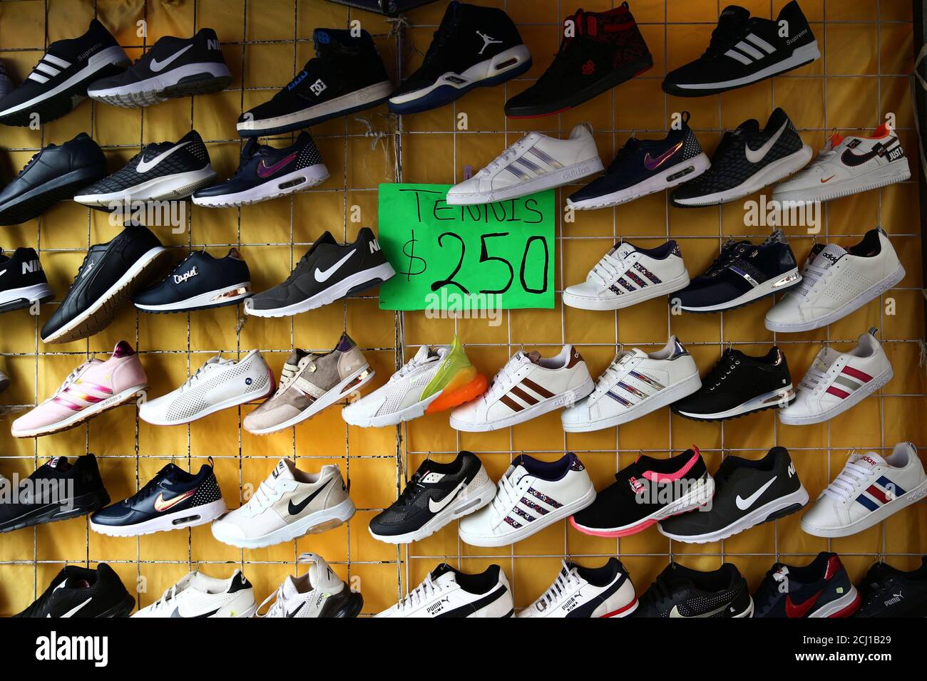 Sports shoes are displayed at a store in Tepito neighborhood in Mexico City,  Mexico May 16, 2019. REUTERS/Edgard Garrido Stock Photo - Alamy