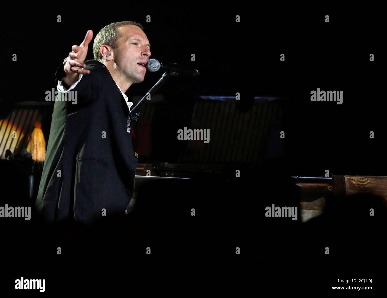 Coldplay lead singer Chris Martin performs during a show at the Natural