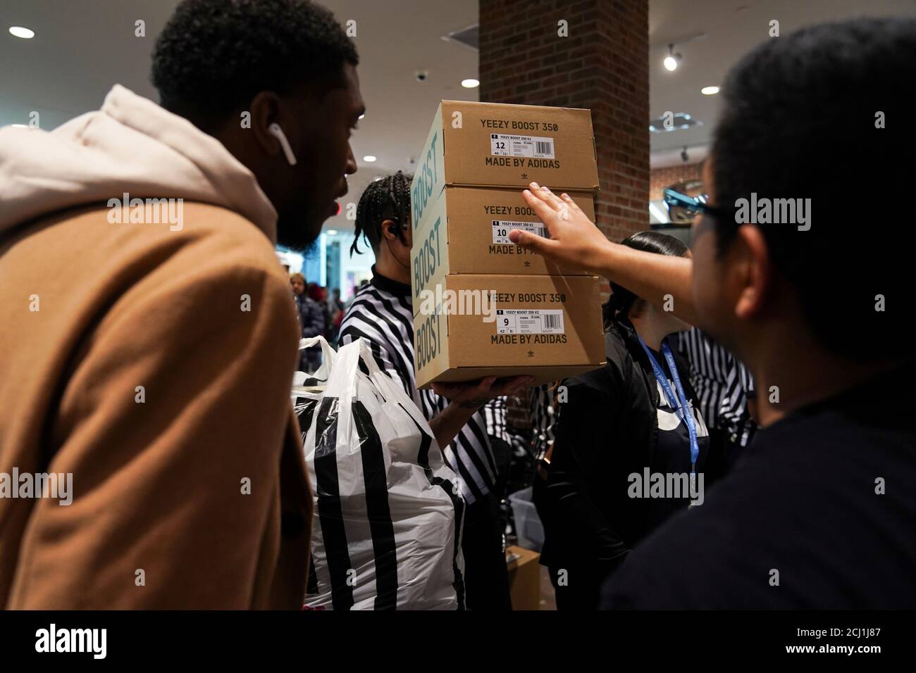 A Foot Locker employee retrieves boxes of Kanye West's Yeezy shoes in King  of Prussia mall on Black Friday, a day that kicks off the holiday shopping  season, in King of Prussia,