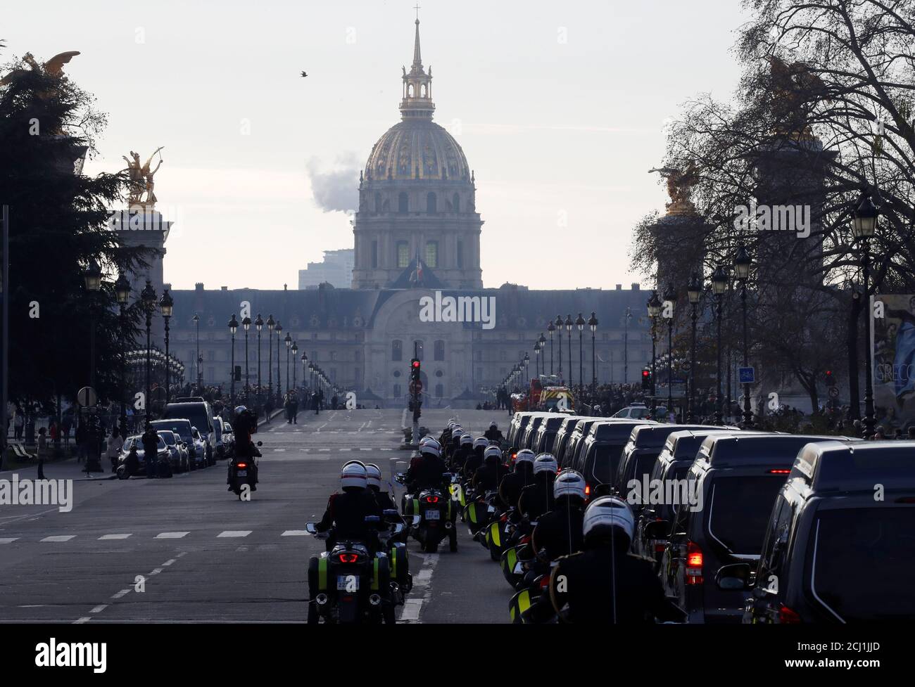 The hearses with the coffins of late thirteen French soldiers killed in Mali make their way past the Alexandre III bridge during a funeral convoy before a ceremony at the Hotel National des Invalides in Paris, France, December 2, 2019. French soldiers Julien Carrette, Benjamin Gireud, Romain Salles de Saint-Paul, Clement Frison-Roche, Nicolas Megard, Romain Chomel de Jarnieu, Pierre Bockel, Alex Morisse, Jeremy Leusie, Alexandre Protin, Antoine Serre, Valentin Duval, Andrei Jouk died in Mali when their helicopters collided in the dark last week as they hunted for Islamist militants.   REUTERS/ Stock Photo