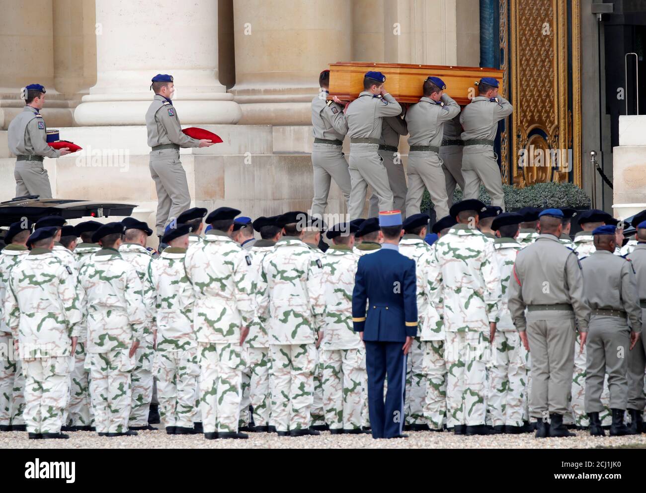 Soldiers carry the coffins of late thirteen French soldiers killed in Mali, before a ceremony at the Hotel National des Invalides in Paris, France, December 2, 2019. French soldiers Julien Carrette, Benjamin Gireud, Romain Salles de Saint-Paul, Clement Frison-Roche, Nicolas Megard, Romain Chomel de Jarnieu, Pierre Bockel, Alex Morisse, Jeremy Leusie, Alexandre Protin, Antoine Serre, Valentin Duval, Andrei Jouk died in Mali when their helicopters collided in the dark last week as they hunted for Islamist militants.   REUTERS/Charles Platiau Stock Photo