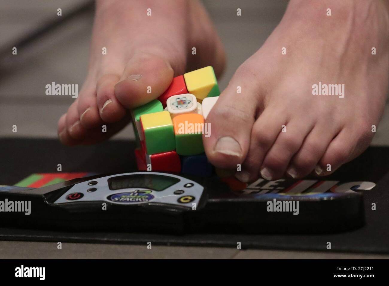 Guinness World record holder for solving a Rubik's cube with his feet Daniel  Rose-Levine practices on solving it in New York, U.S., March 11, 2019.  REUTERS/Shannon Stapleton Stock Photo - Alamy