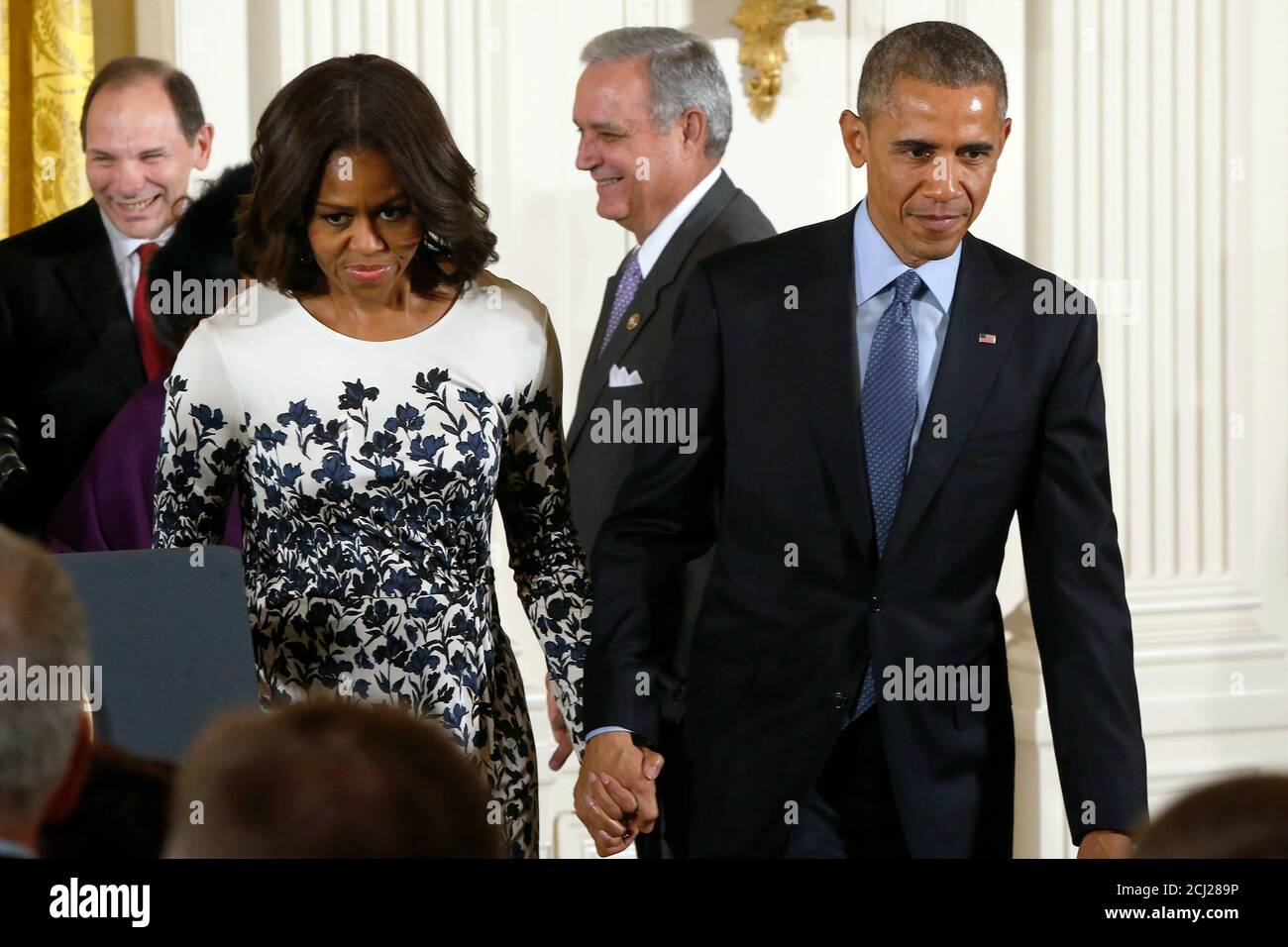 U.S. President Barack Obama and first lady Michelle Obama depart after a signing ceremony for the the Clay Hunt Suicide Prevention for American Veterans Act into law at the White House in Washington February 12, 2015. The bill is named after Clay Hunt, a Marine who committed suicide in 2011, suffering from post-traumatic stress disorder (PTSD) after serving in Iraq and Afghanistan.   REUTERS/Jonathan Ernst  (UNITED STATES - Tags: POLITICS MILITARY HEALTH) Stock Photo