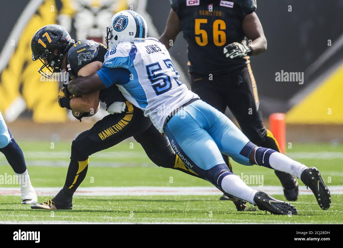 Hamilton Tiger-Cats' Luke Tasker (L) runs as he is tackled by Toronto  Argonauts' Gregory Jones (R) during the first half of their CFL football  game in Hamilton, Ontario, Canada, September 7, 2015.