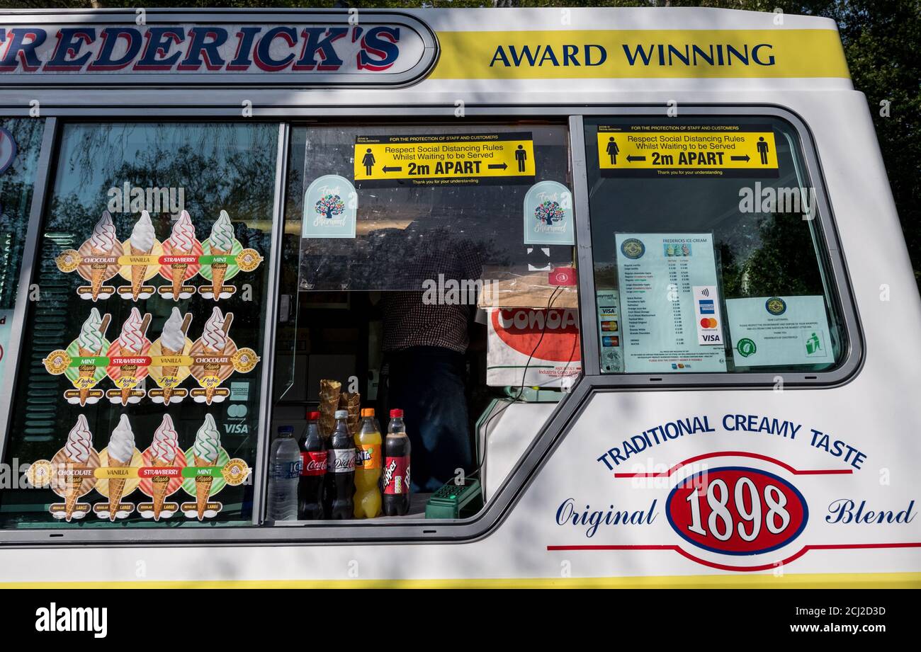 Ice cream van with 2m social distance sign. Stock Photo