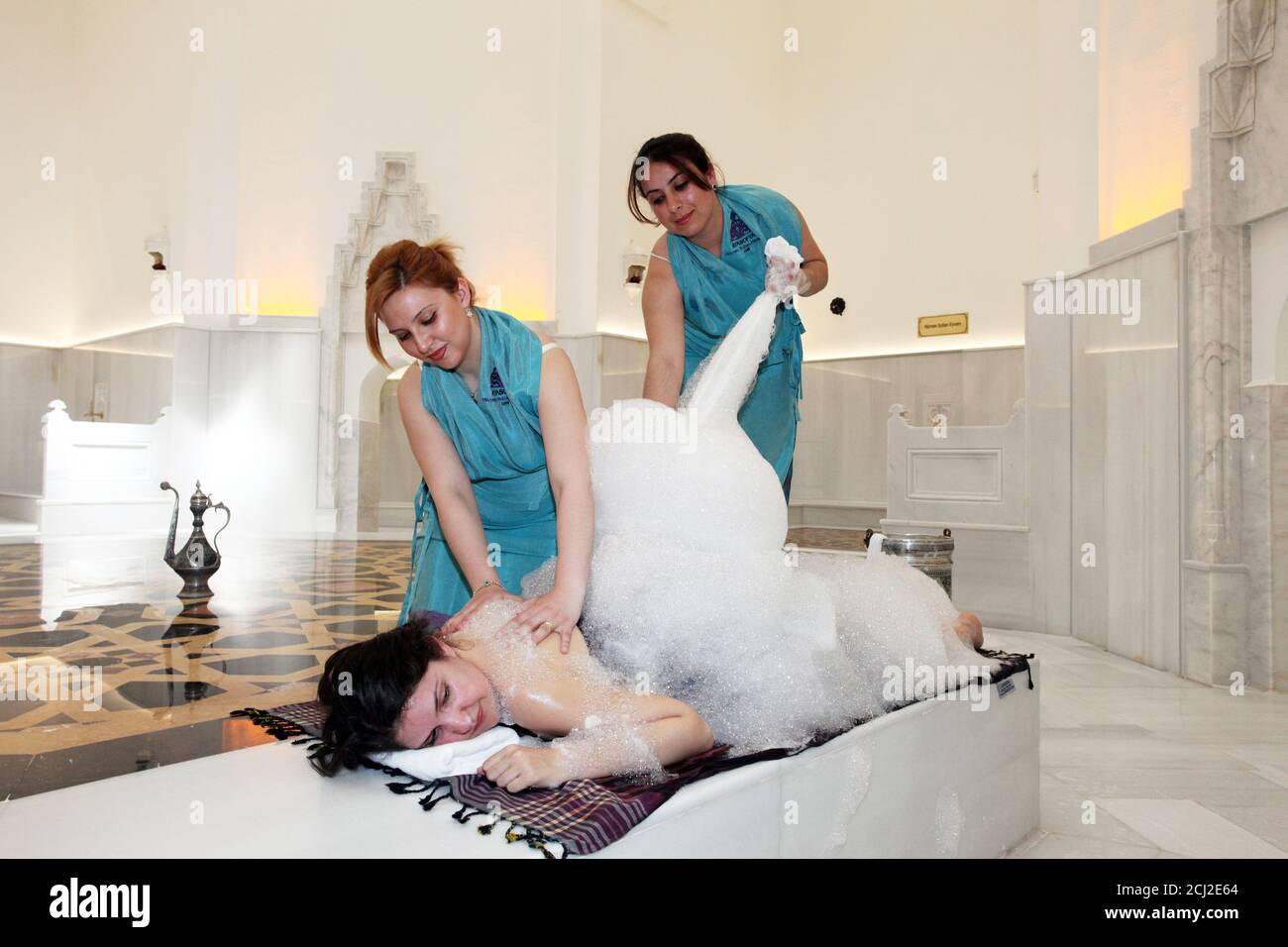 ISTANBUL, TURKEY MAY 11 Female bath attendants soap sud massages and