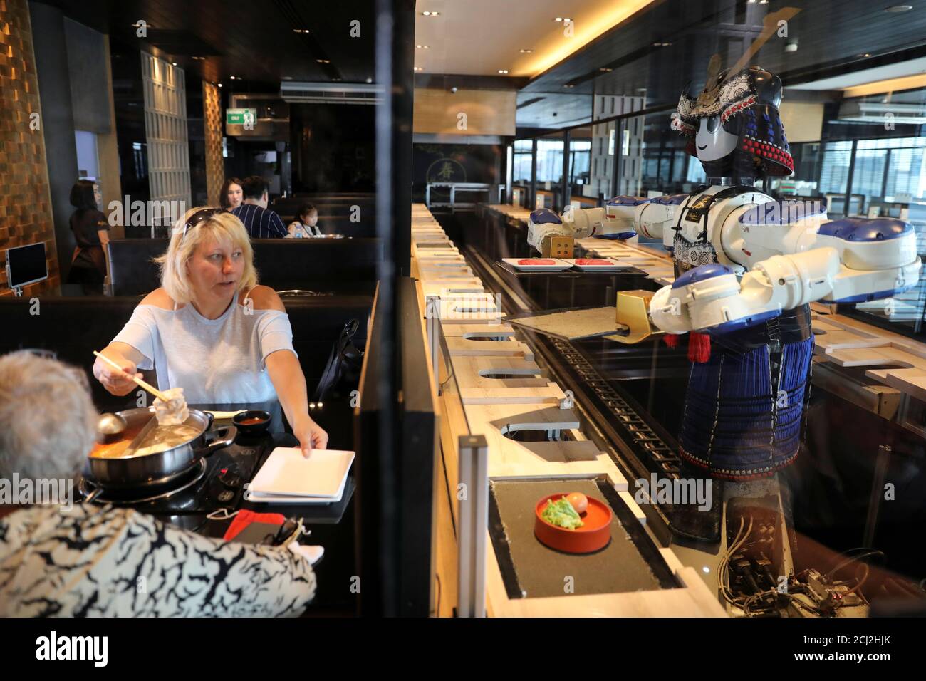 A robot waitress brings food to a table at the Hajime Robot restaurant in  Bangkok, Thailand February 9, 2019. REUTERS/Jorge Silva Stock Photo - Alamy