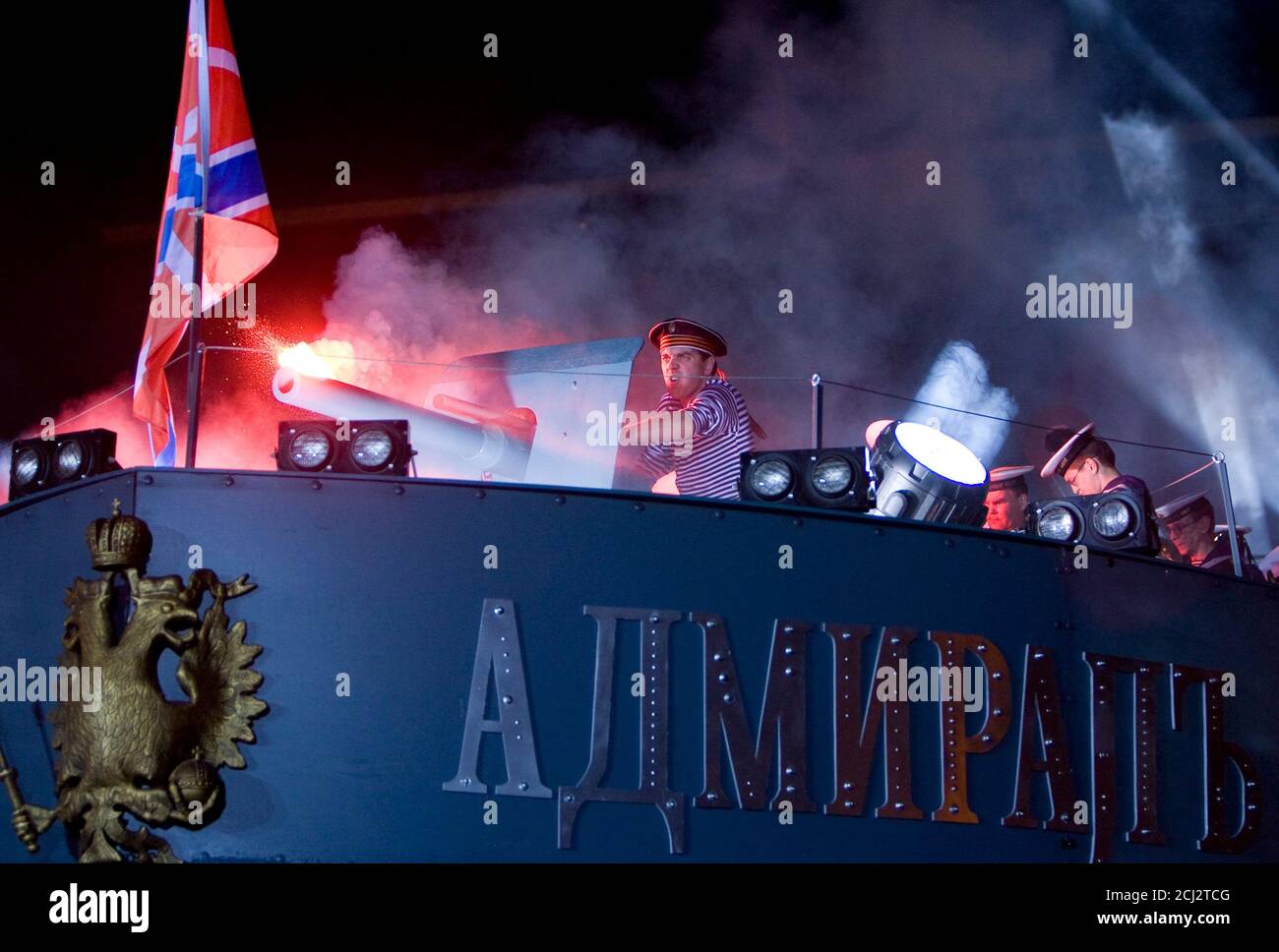 Sailors perform a mock sea battle on a fake war vessel in front of a Moscow cinema to promote Russia's latest blockbuster, October 6, 2008. The movie 'Admiral' hopes to woo big foreign audiences with an epic tale of doomed love set amid the chaos of the Russian Civil War; its politics conveniently chime with a Kremlin-sponsored mood of patriotism.  REUTERS/Thomas Peter  (RUSSIA) Stock Photo
