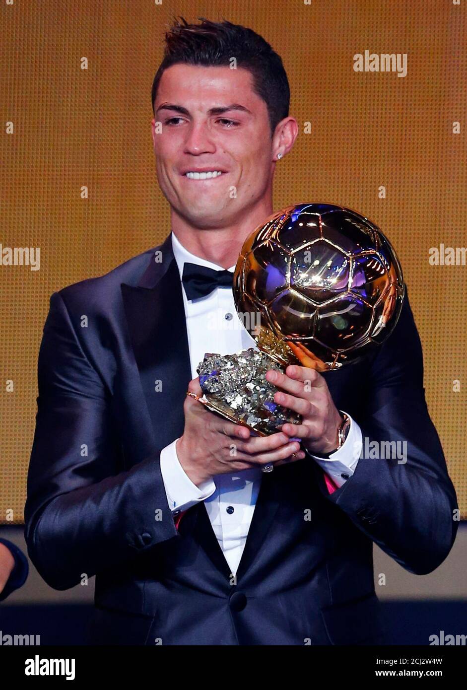 Portugal's Cristiano Ronaldo holds his trophy after being awarded the FIFA Ballon  d'Or 2013 in Zurich January 13, 2014. Portugal and Real Madrid forward  Cristiano Ronaldo was named the world's best footballer