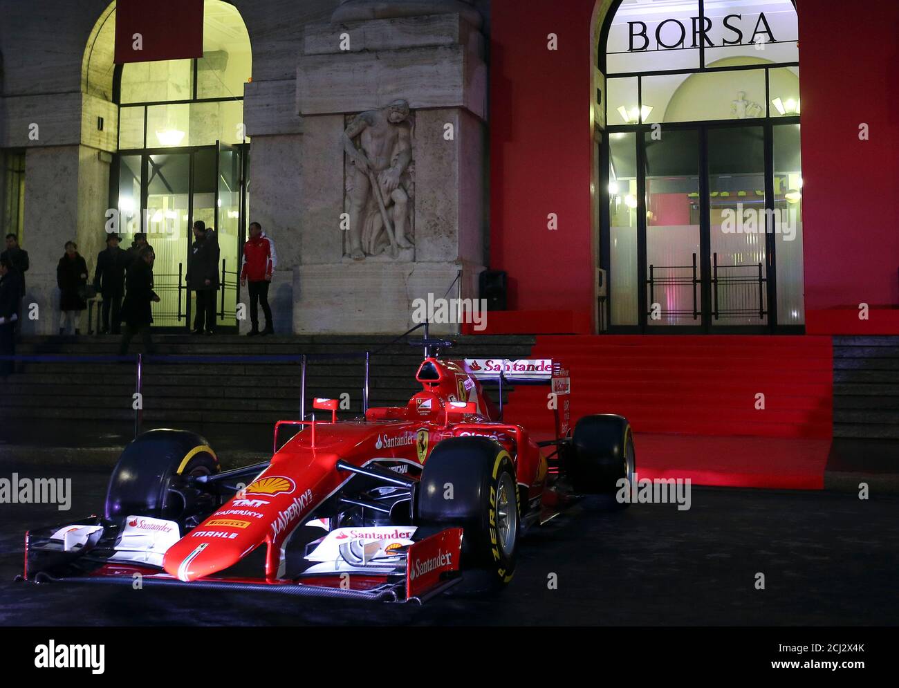 A Ferrari Formula One sports car is seen in front of Milan's stock  exchange, downtown Milan, Italy January 4, 2016. Ferrari shares opened at  43 euros in their Milan bourse debut on