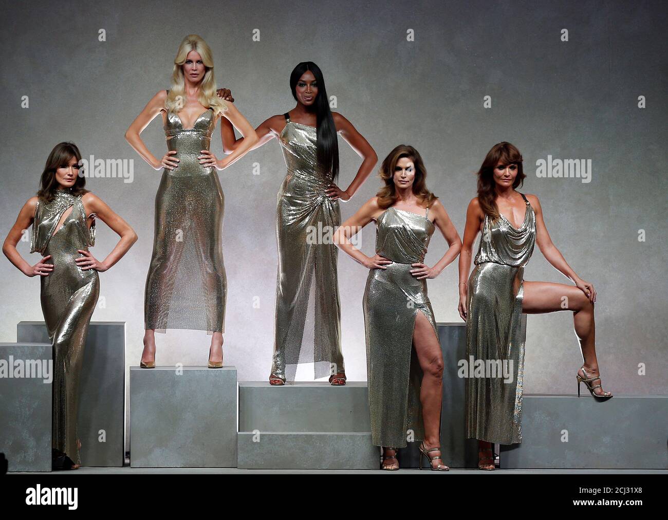 Former top models Carla Bruni (L), Claudia Schiffer, Naomi Campbell, Cindy  Crawford and Helena Christensen display iconic creations of late Italian  designer Gianni Versace's during the Versace Spring/Summer 2018 show at the
