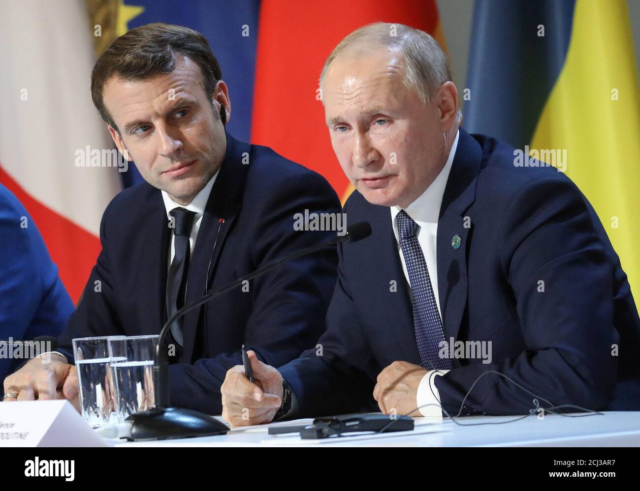 French President Emmanuel Macron and Russian President Vladimir Putin give a press conference after a summit on Ukraine at the Elysee Palace in Paris, December 9, 2019.  Ludovic Marin/Pool via REUTERS Stock Photo