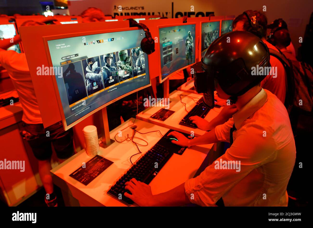 A cosplayer wears a self-made helmet of a character from the computer game  PlayerUnknown's Battlegrounds, a survival-shooter game of South Korean game  developer Bluehole Studio Inc., while testing Ubisoft Montreal's Tom  Clancy's