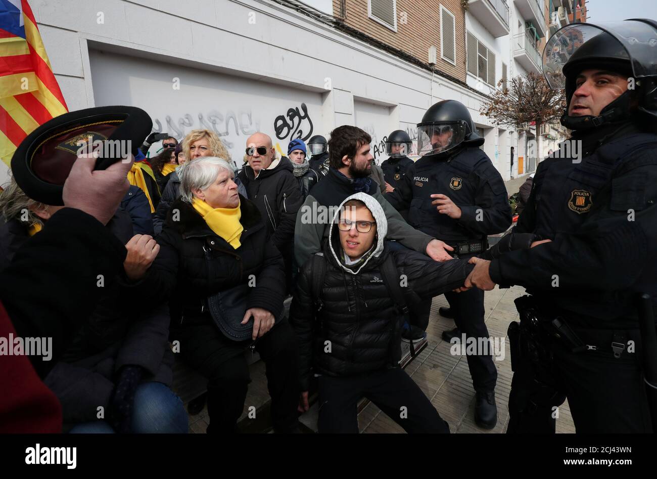 Mossos d'Escuadra police remove protestors from the entrance of People's Party (PP) meeting in Lleida, Spain, December 18, 2017. REUTERS/Albert Gea Stock Photo