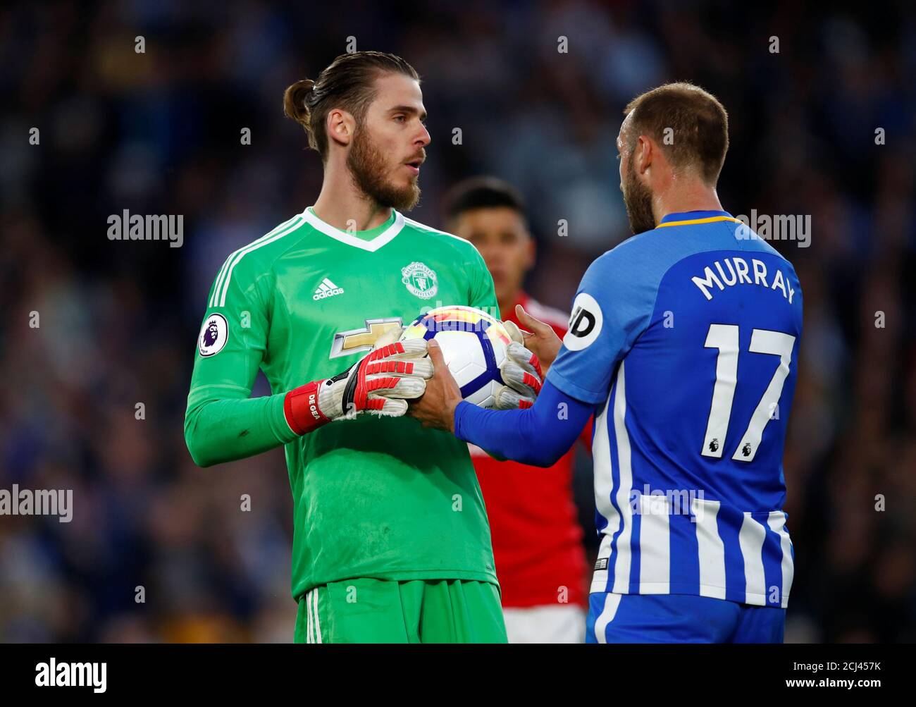 Soccer Football - Premier League - Brighton & Hove Albion v Manchester United - The American Express Community Stadium, Brighton, Britain - May 4, 2018   Manchester United's David De Gea with Brighton's Glenn Murray    REUTERS/Eddie Keogh    EDITORIAL USE ONLY. No use with unauthorized audio, video, data, fixture lists, club/league logos or 'live' services. Online in-match use limited to 75 images, no video emulation. No use in betting, games or single club/league/player publications.  Please contact your account representative for further details. Stock Photo