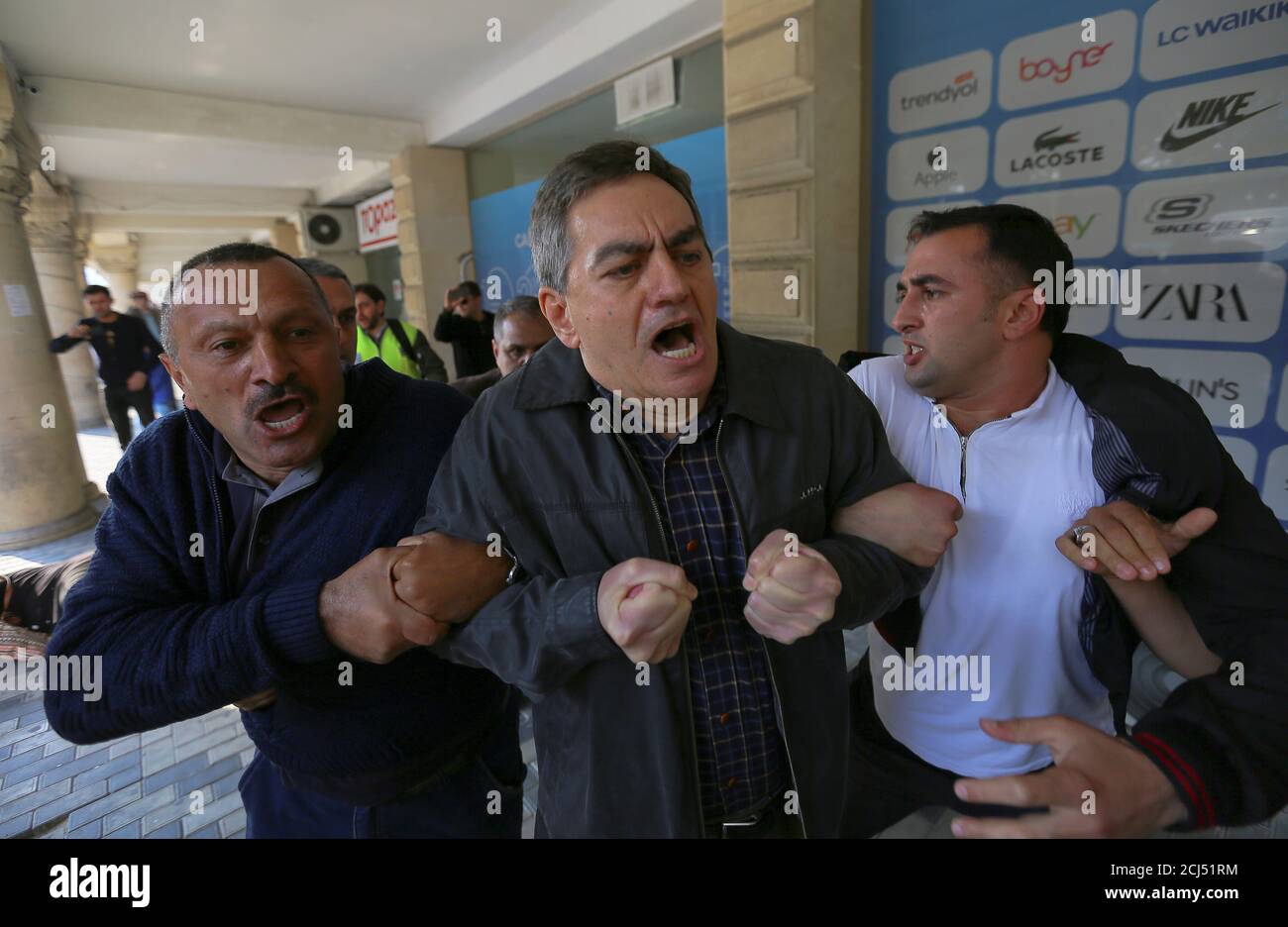 Head of the Popular Front Party of Azerbaijan Ali Karimli and his supporters hold an unauthorized rally to demand the freedom of assembly in Baku, Azerbaijan October 19, 2019. REUTERS/Aziz Karimov Stock Photo