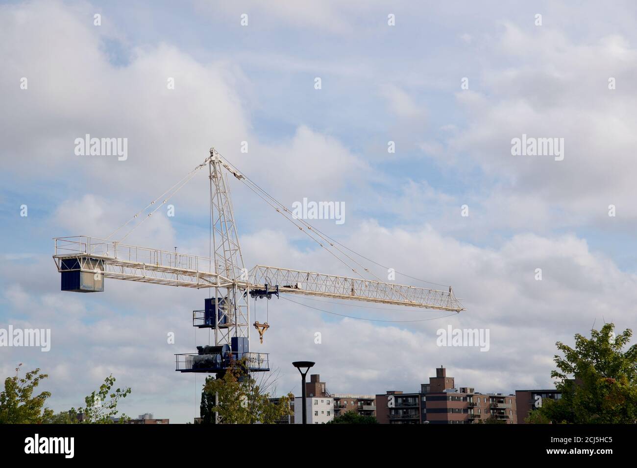 Construction site with crane and blue sky background Stock Photo