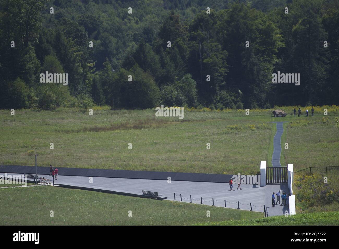 Visitors pay their respects at the crash site of Flight 93, a United States National Park Service Memorial which opened on Wednesday in Shanksville, Pennsylvania, September 9, 2015. The new $50 million visitors center at the heart of a national memorial created out of the crash site will be formally dedicated on Thursday, a day before ceremonies mark the fourteenth anniversary of the worst terrorist attack on American soil.  On September 11, 2001, one of the four planes overtaken by al Qaeda terrorists crashed into Pennsylvania, killing all 40 passengers aboard.  A 9-11 memorial ceremony will  Stock Photo