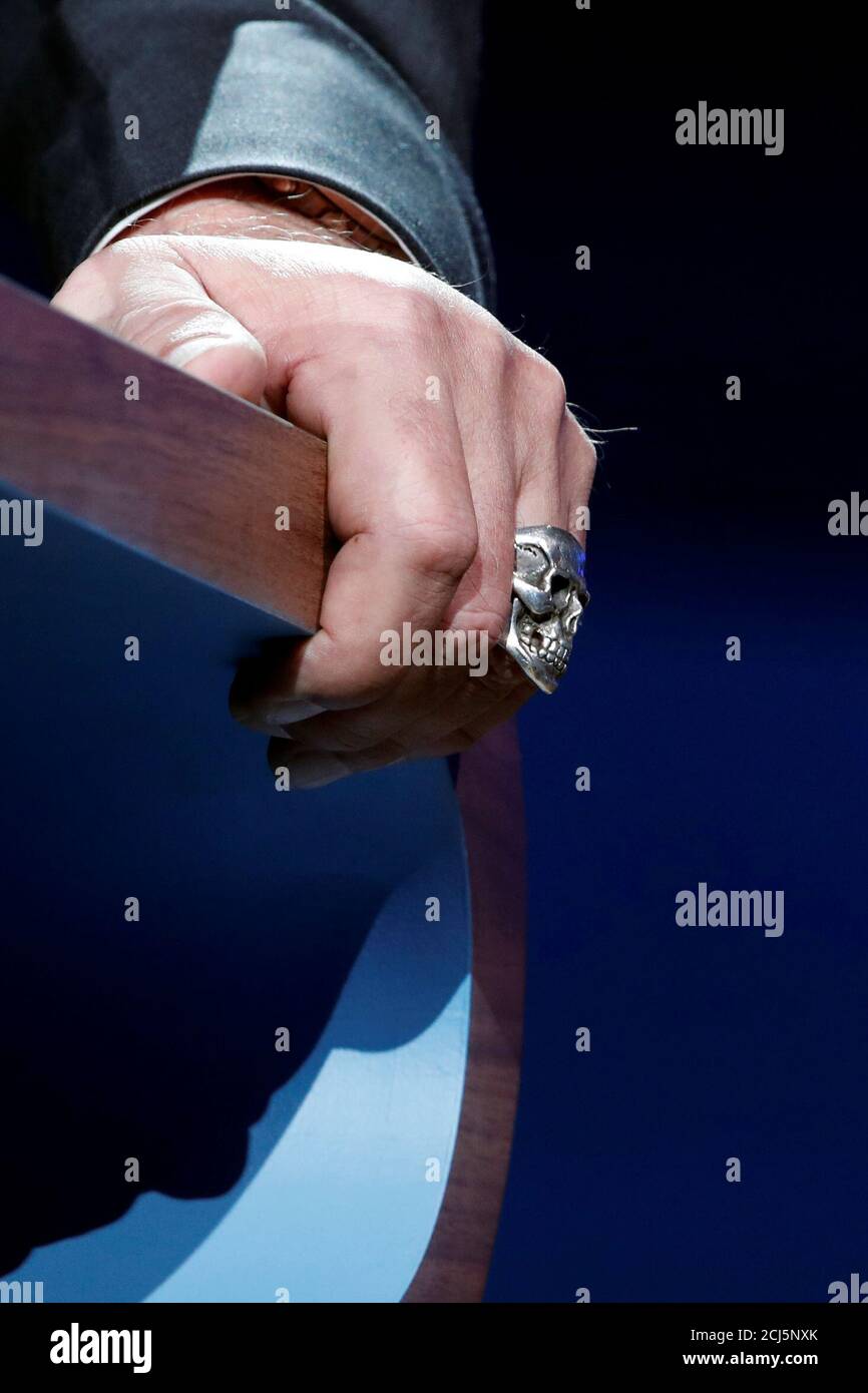 A skull ring is worn by R20 Founder and former California state governor Arnold  Schwarzenegger as he delivers a speech during the One Planet Summit at the  Seine Musicale center in Boulogne-Billancourt,