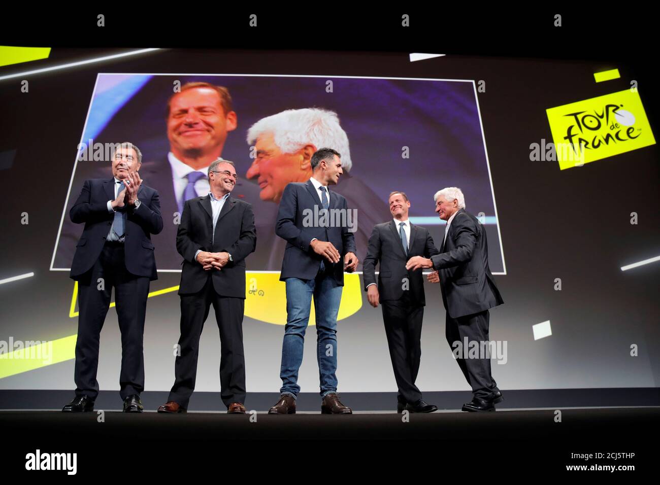 Tour De France Five Time Winners Eddy Merckx Bernard Hinault Miguel Indurain Tour De France Director Christian Prudhomme And Cyclist Raymond Poulidor Pose On Stage During A News Conference To Unveil The 2019