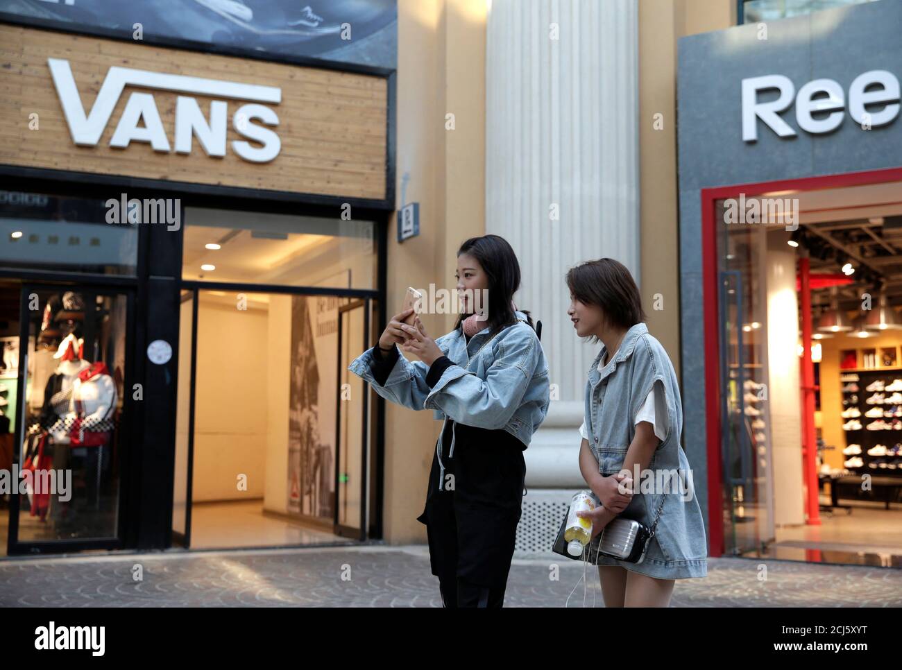 Young women are seen outside a Vans store at a shopping center in Beijing,  China October 8, 2019. REUTERS/Jason Lee Stock Photo - Alamy