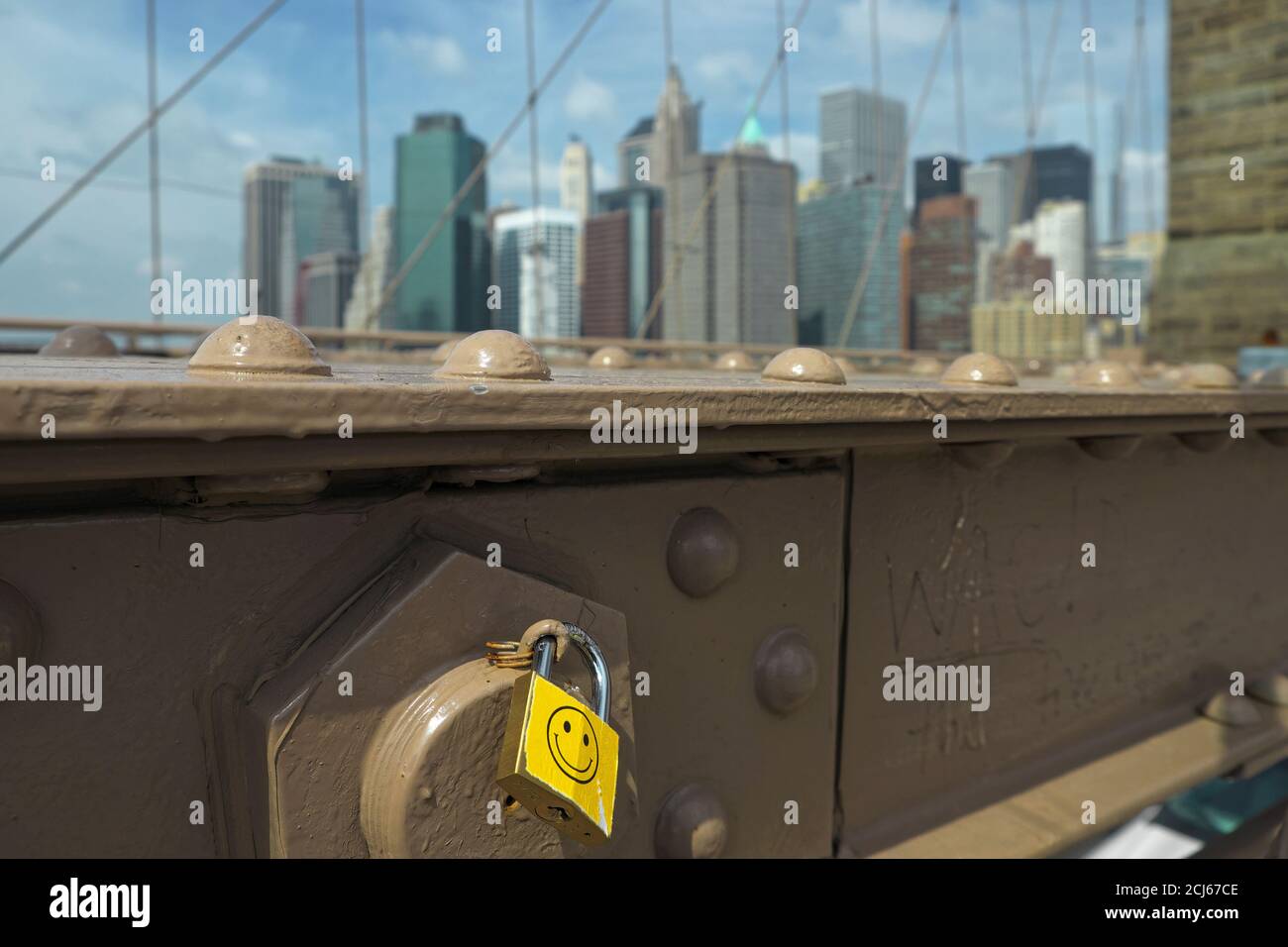 Smile is padlocked at Manhattan Bridge for those to passing by. Stock Photo