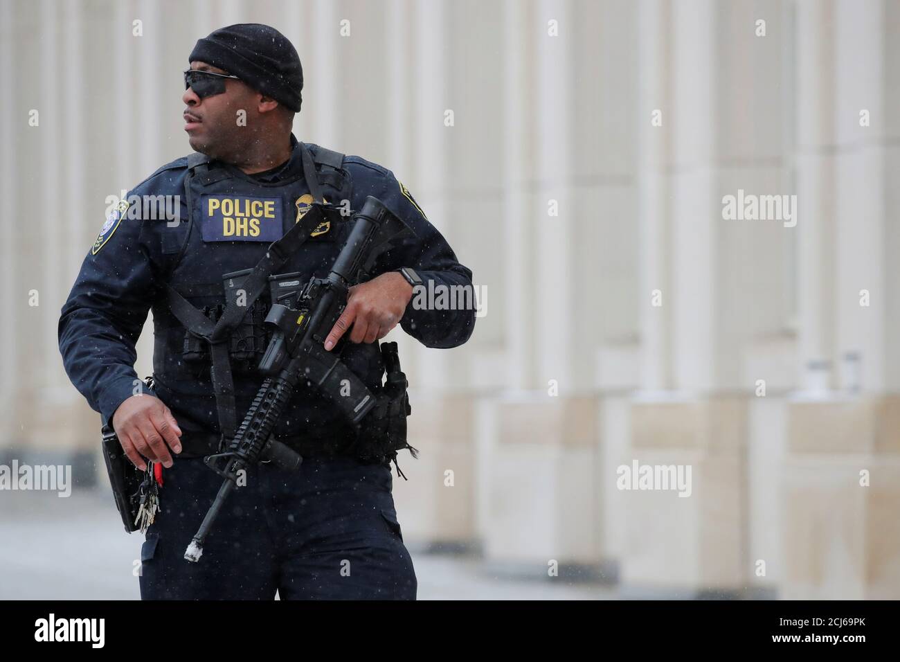 Department of Homeland Security (DHS) officer stands guard outside of the  trial of Mexican drug lord Joaquin Guzman, known as "El Chapo," at the  Brooklyn Federal Courthouse, during his trial in New