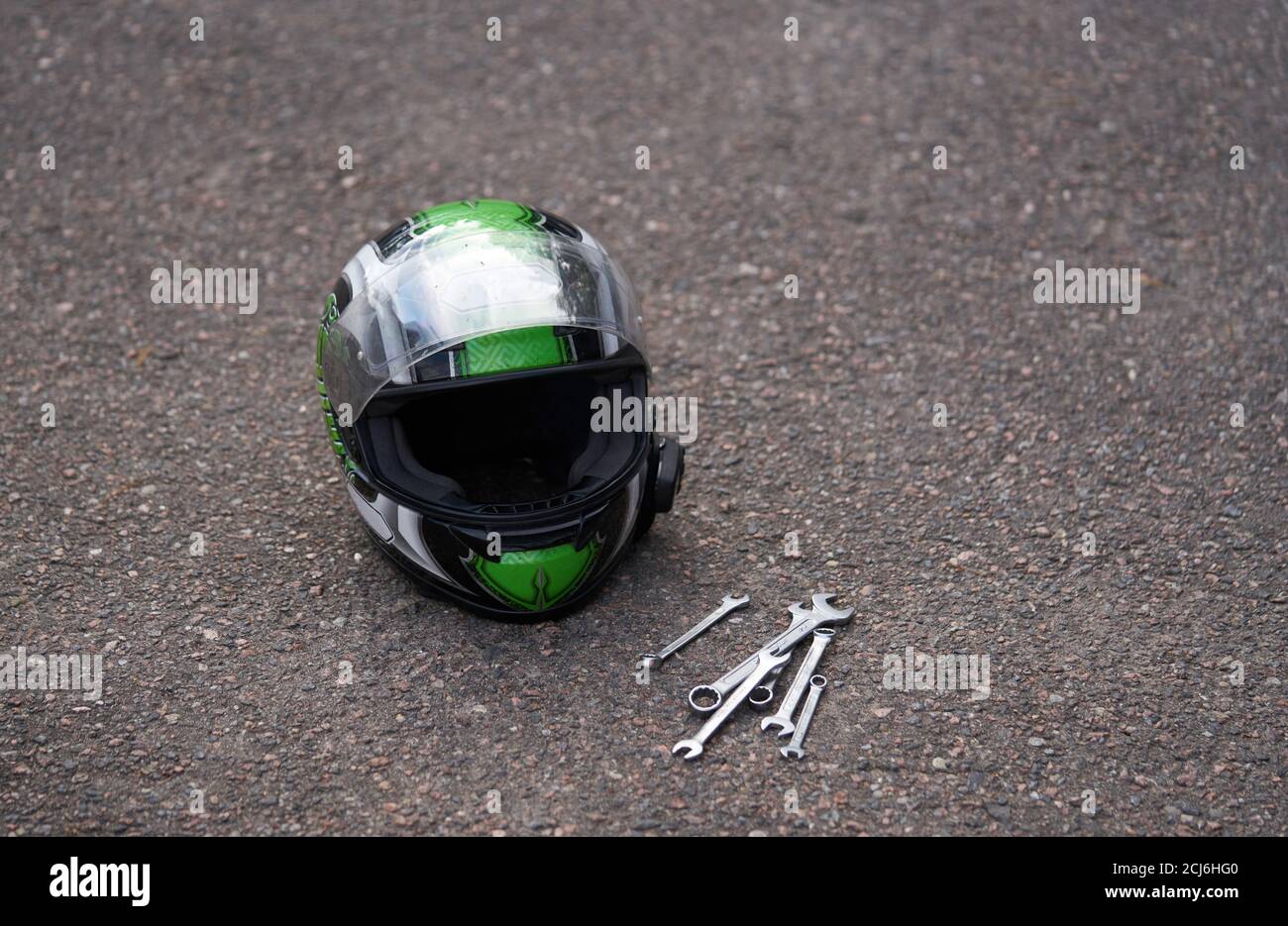 Motorcycle helmet at ground and some tools Stock Photo Alamy