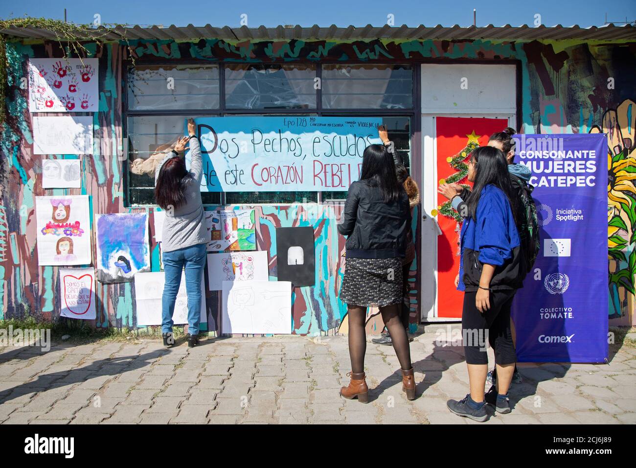 Students place placards before taking part in a performance against gender  violence, as part of a joint project of the European Union (EU) and the  United Nations (UN) under the Spotlight Initiative