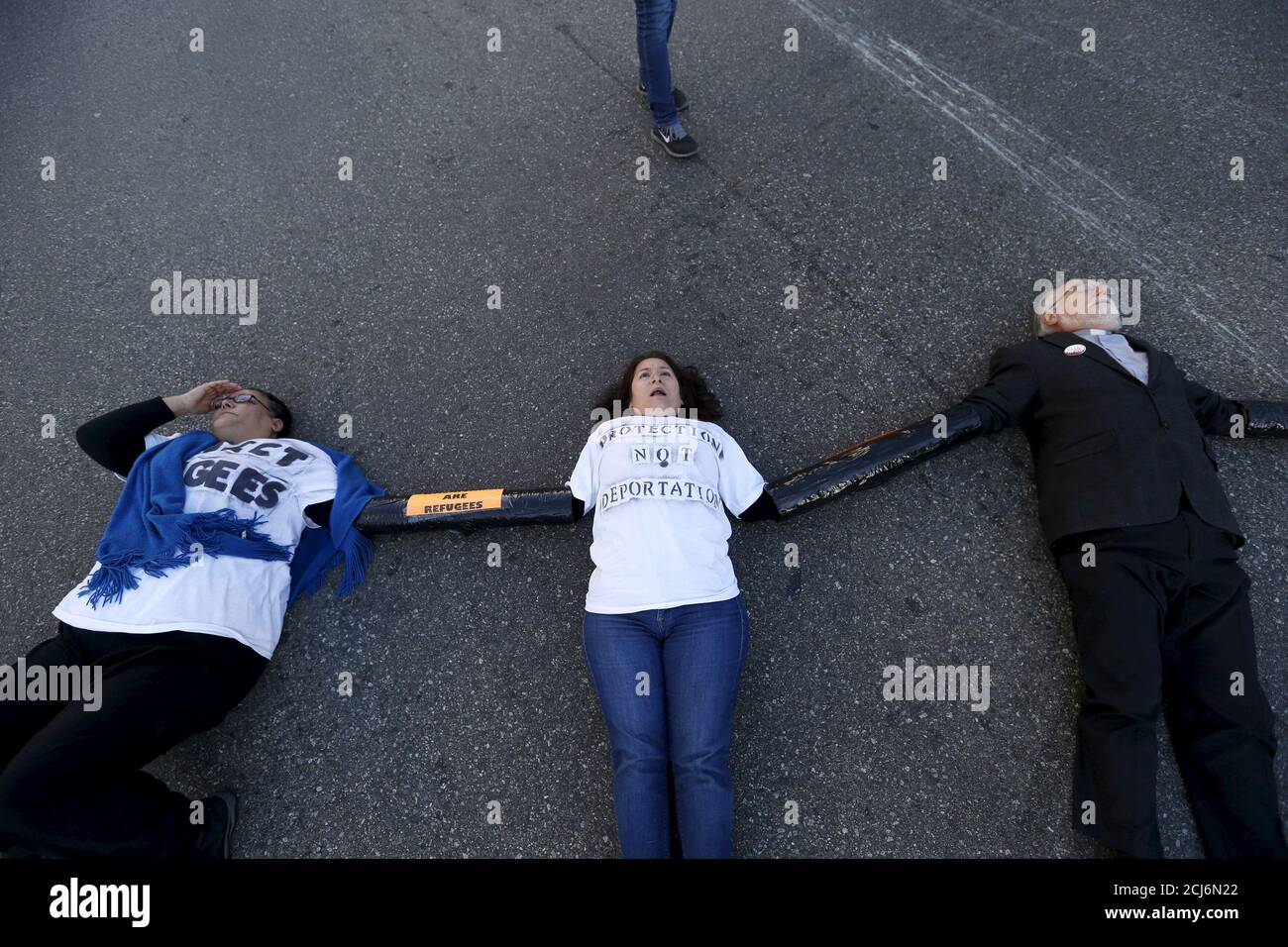 People block an intersection as they gather outside a Federal Building while protesting against Immigration and Customs Enforcement (ICE) raids on Central American refugees in Los Angeles, California January 26, 2016.   REUTERS/Mario Anzuoni      TPX IMAGES OF THE DAY Stock Photo