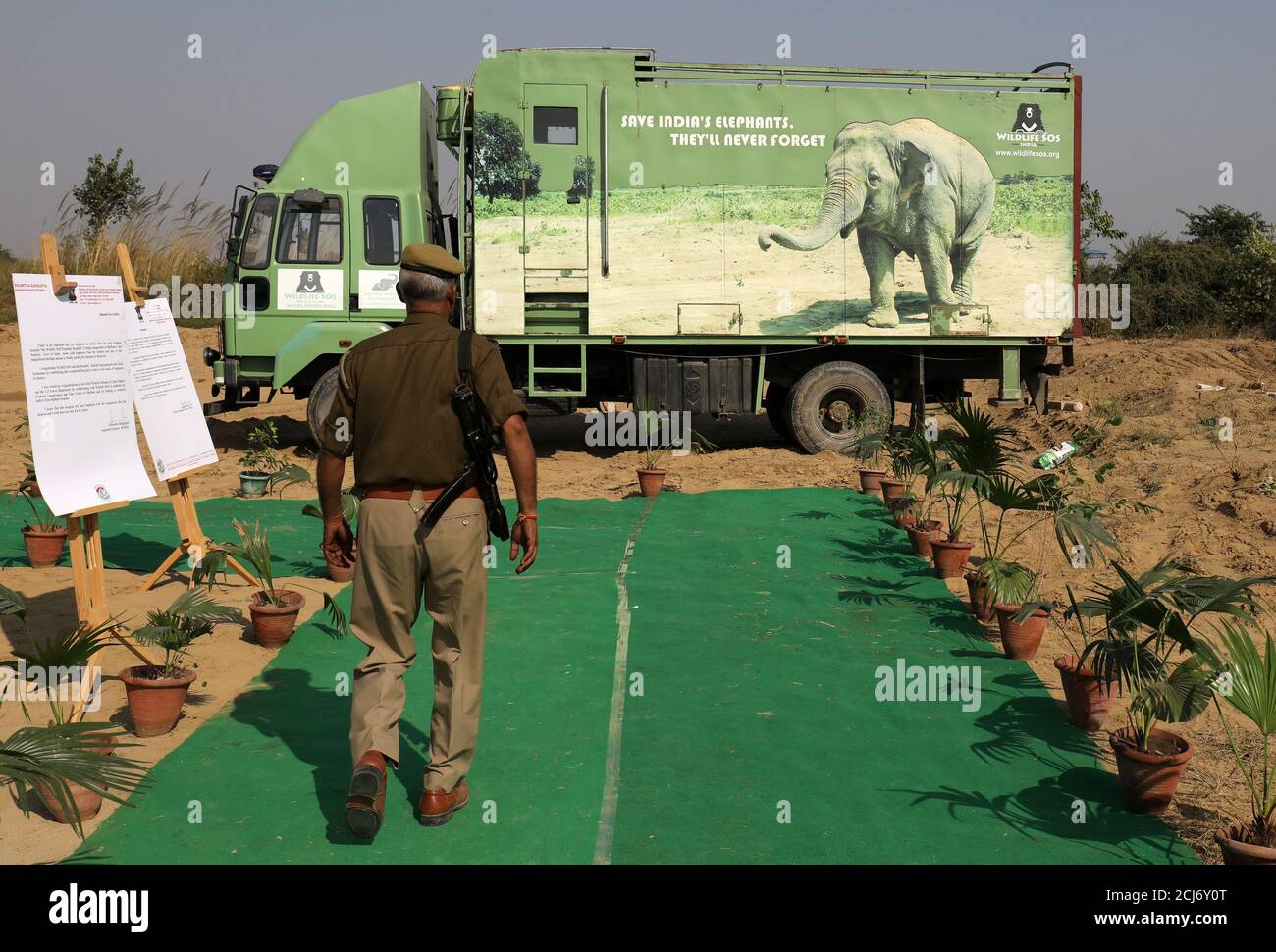 A security officer walks next to an animal ambulance at the Wildlife SOS  Elephant Hospital, India's first hospital for elephants run by a  non-governmental organisation, in the northern town of Mathura, India,