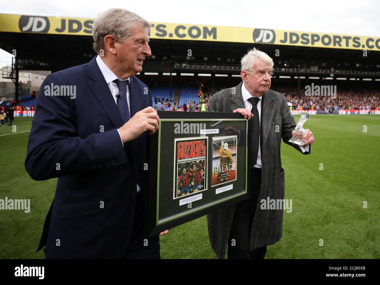 Soccer Football - Premier League - Crystal Palace vs West Bromwich Albion - Selhurst Park, London, Britain - May 13, 2018   Crystal Palace manager Roy Hodgson presents an award to commentator John Motson after the match   REUTERS/Hannah McKay    EDITORIAL USE ONLY. No use with unauthorized audio, video, data, fixture lists, club/league logos or 'live' services. Online in-match use limited to 75 images, no video emulation. No use in betting, games or single club/league/player publications.  Please contact your account representative for further details. Stock Photo