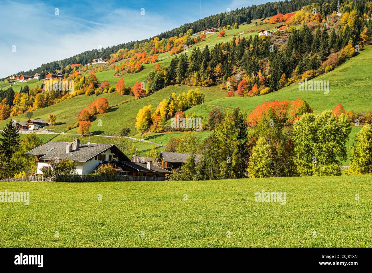 Early autumn in the village of Santa Magdalena in northern Italy on the slopes of the Dolomites in the valley of Val di Funes. Stock Photo
