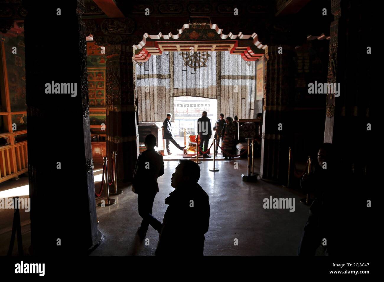 Tourists and believers visit the Potala Palace in Lhasa, Tibet Autonomous Region, China November 17, 2015. The Potala Palace, once the seat of Tibetan government and traditional residence of Dalai Lama, is a 13-storey, 1000-room palace that is more than 1,300 years old and is more than 3,700 meters above sea level. It is a UNESCO World Heritage site. REUTERS/Damir Sagolj Stock Photo