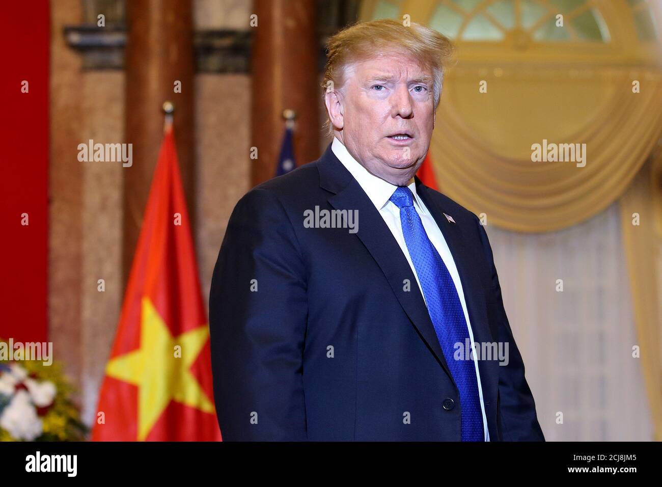 US President Donald J. Trump walks into a meeting room at the Presidential Palace to meet with Vietnamese President Nguyen Phu Trong in Hanoi, Vietnam 27 February 2019, ahead of the second summit between US President Trump and North Korean leader Kim Jong-un. Luong Thai Linh/Pool via Reuters Stock Photo