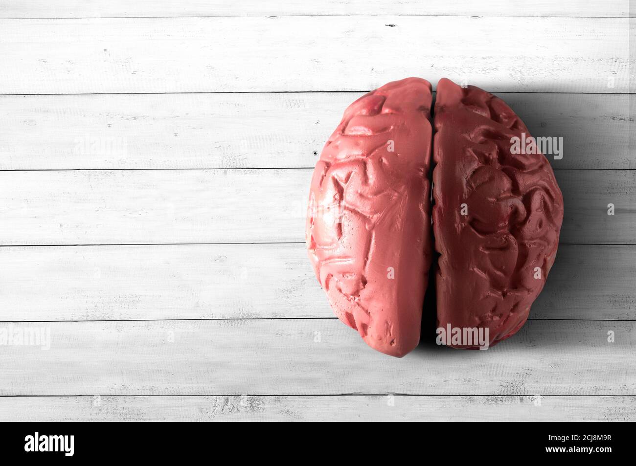 Brain On Table The human brain with wooden table background Stock Photo - Alamy