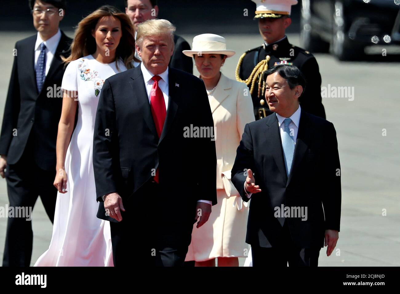 U.S. President Donald Trump and U.S. first lady Melania Trump are escorted  by Japan's Emperor Naruhito and Empress Masako during an welcome ceremony  at the Imperial Palace in Tokyo, Japan May 27,