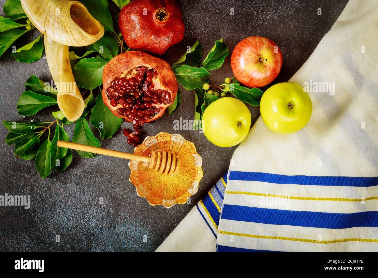 Jewish prayer talit with traditional food and horn for rosh hashanah ...