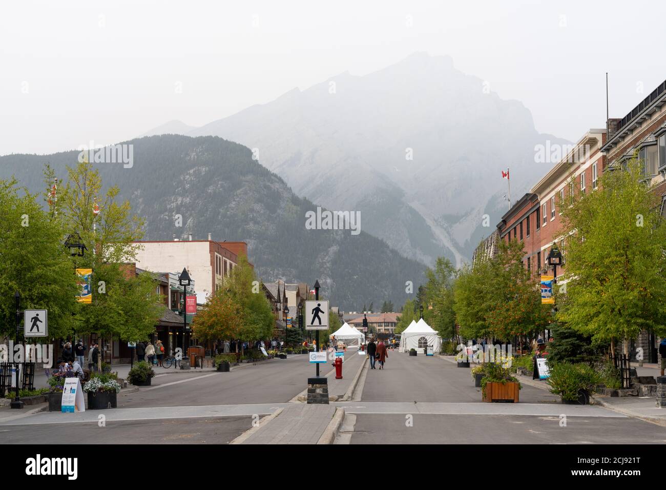 Downtown Banff Avenue as a haze. Smoke from the forest wildfires. Poor air quality. Stock Photo