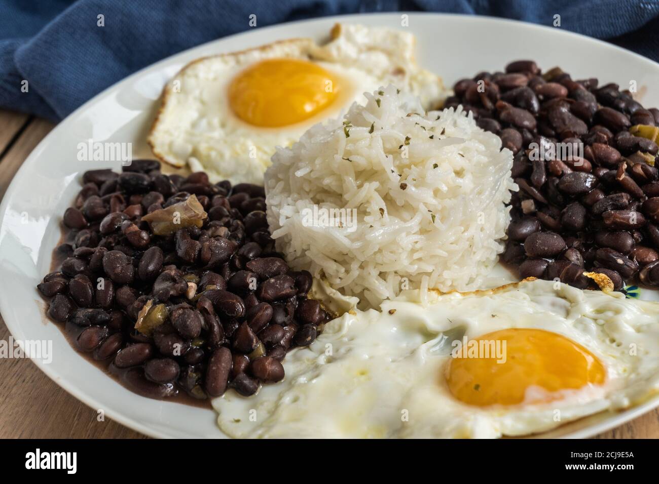 Dish of traditional Cuban cuisine with black beans, rice, and eggs Stock Photo