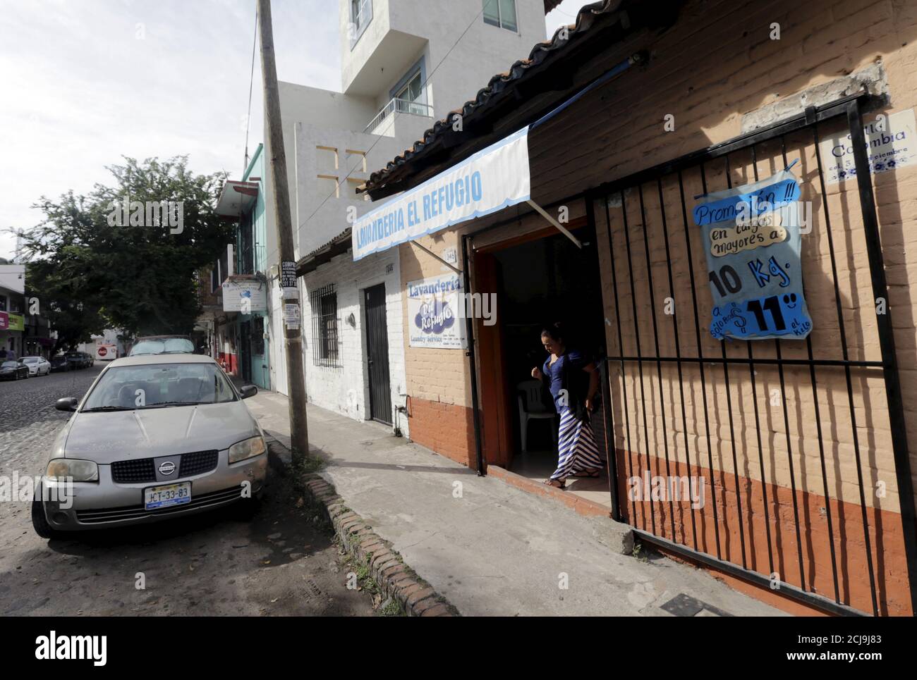 A client leaves the laundromat where Tonya Couch gave a false name, during her stay with her son