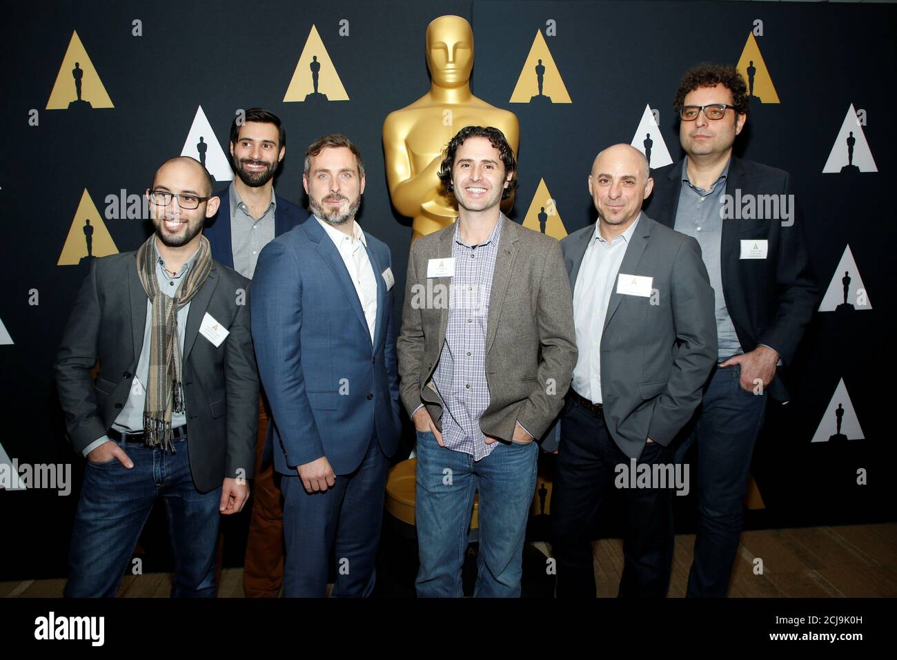 Nominees in the Short Film (Animated) category pose together during a  reception for the Academy Award nominated films in the Short Film (Animated)  and Short Film (Live Action) categories at the Academy