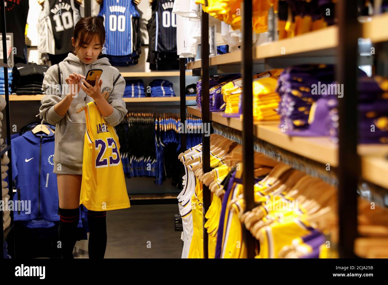 A customer shops in the NBA Store in New York City, U.S., October 7, 2019.  REUTERS/Brendan McDermid Stock Photo - Alamy