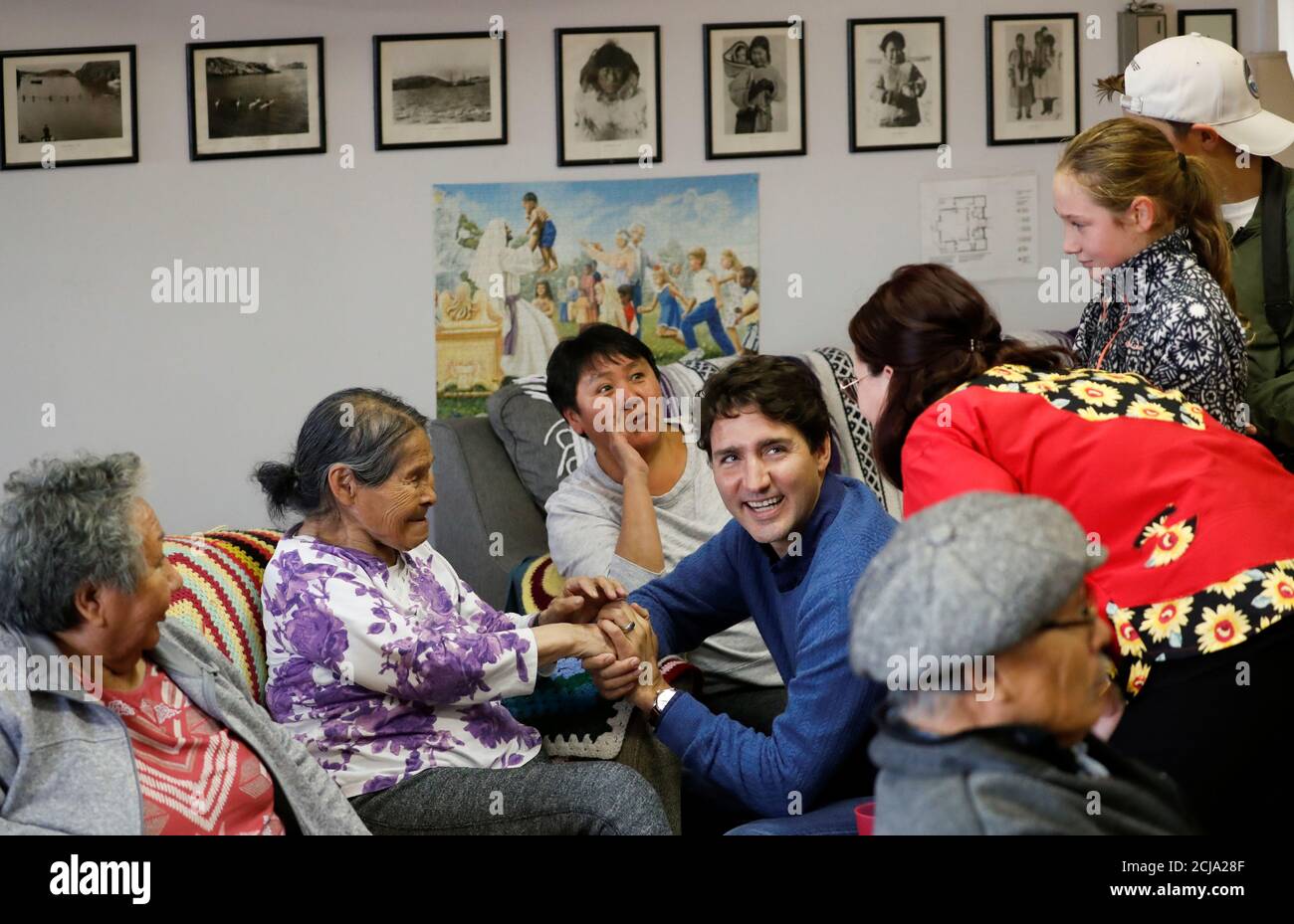 Liberal leader and Canadian Prime Minister Justin Trudeau, accompanied by his kids Ella-Grace Margaret and Xavier James and by Nunavut's Liberal candidate Megan Pizzo-Lyall, meets with elders during an election campaign visit to Iqaluit, Nunavut, Canada October 8, 2019. REUTERS/Stephane Mahe Stock Photo