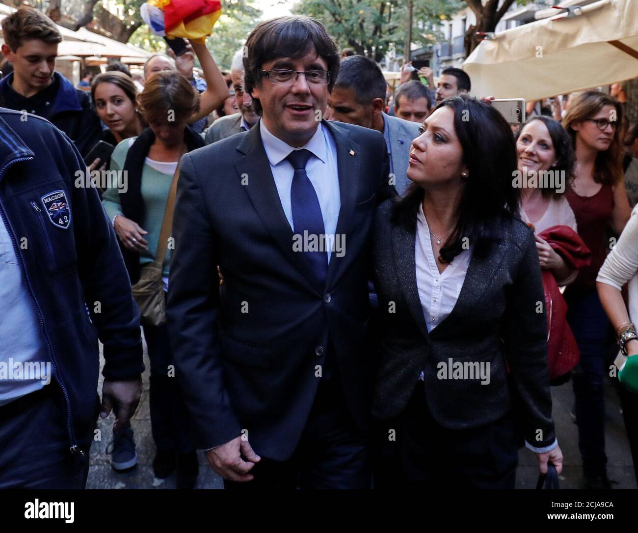 Sacked Catalan President Carles Puigdemont walks with his wife Marcela Topor  during a walkabout through the center the day after the Catalan regional  parliament declared independence from Spain in Girona, Spain, October