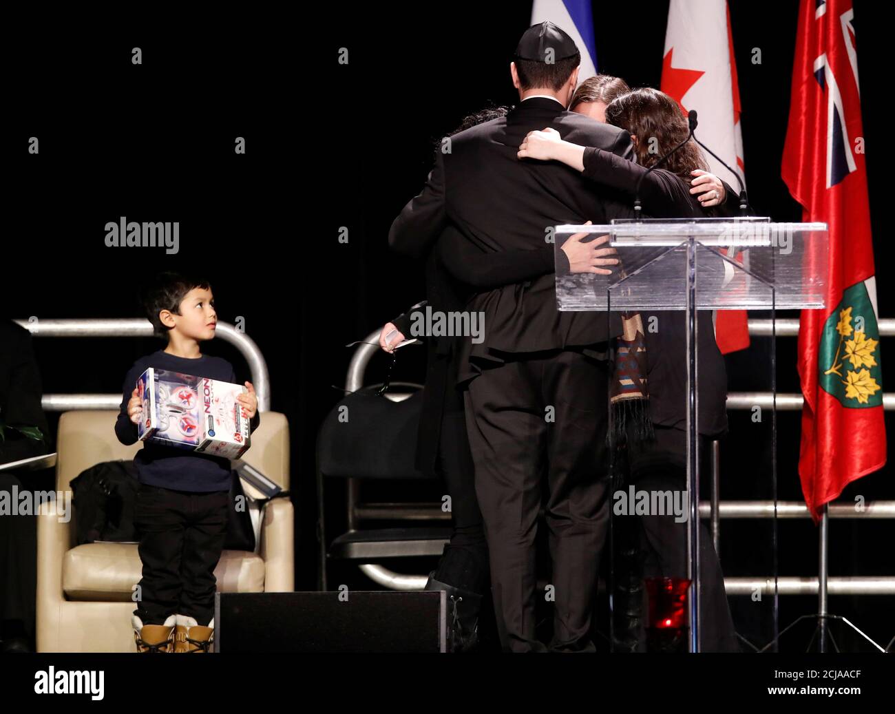 The children of Apotex pharmaceutical billionaire Barry Sherman and his  wife Honey console each other during their memorial, days after what police  called their suspicious deaths in Toronto, Ontario, Canada December 21,