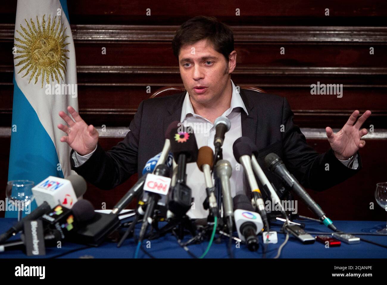 Argentina's Economy Minister Axel Kicillof speaks to the media at a press conference at the Argentine Consulate in New York July 30, 2014. Kicillof on Wednesday said the country offered a group of holdout creditors the same reduced payment terms it has agreed to pay other holders of its restructured bonds, but the holdouts refused the offer. The holdouts, a group of hedge funds that bought the bonds at a steep discount following Argentina's default on $100 billion of debt in 2002, also refused to ask a U.S. court to stay an order the blocks Argentina from paying its other creditors, Kicillof s Stock Photo