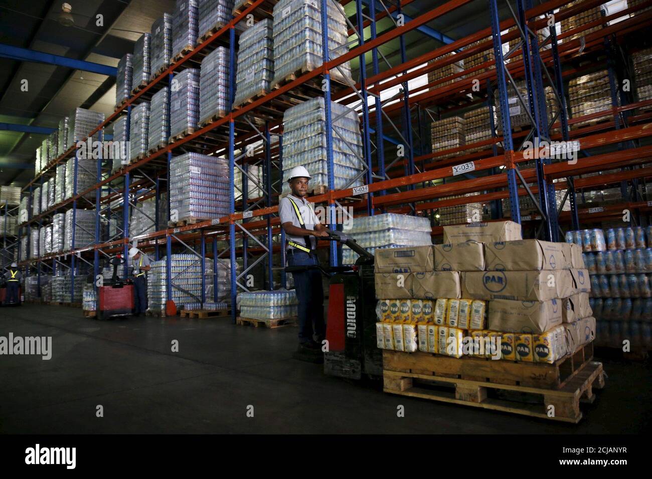 A worker carries packages of PAN corn flour with a forklift at a  distribution center of the food company Empresas Polar in Maracay,  Venezuela, October 27, 2015. Socialist Party legislators are asking